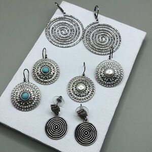 Curated bundle statement style circular spiral statement earring.